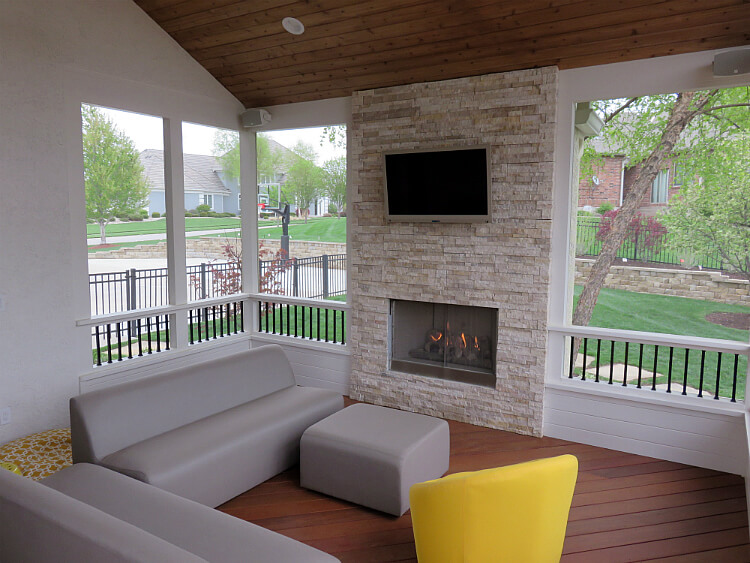 Modern design custom screened porch with outdoor fireplace
