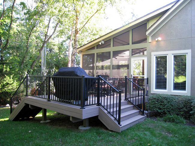 Custom screened porch and deck with outdoor kitchen