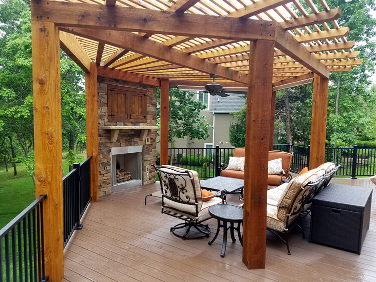 Outdoor fireplace and pergola on deck