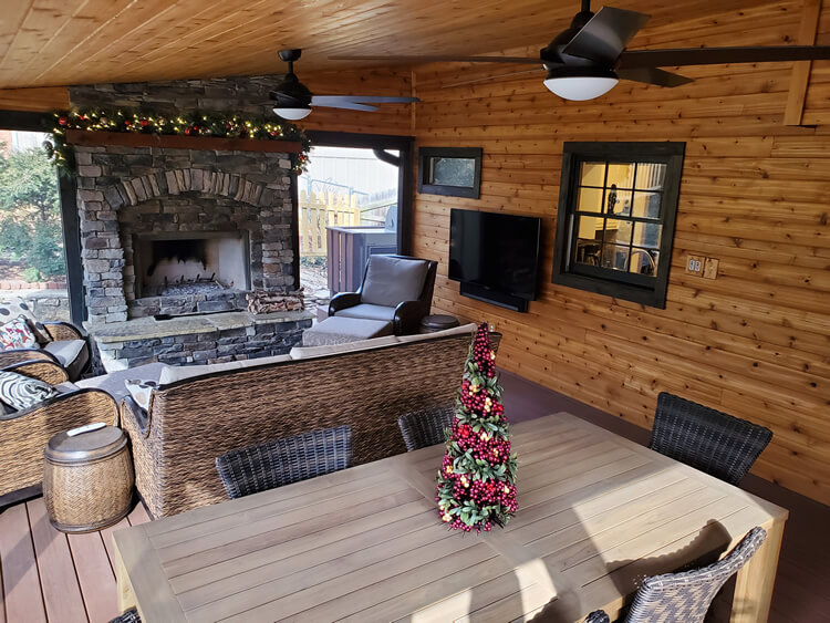 Screened porch with fireplace and Christmas decors