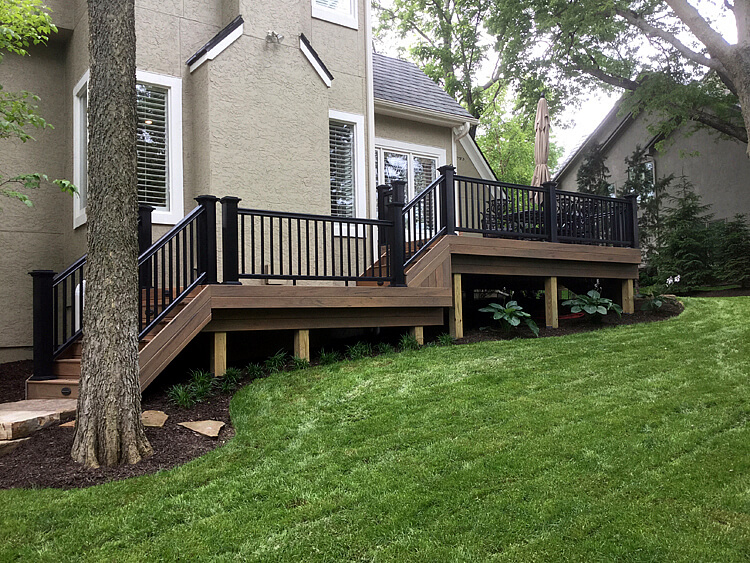 Low maintenance deck with railing and lighting