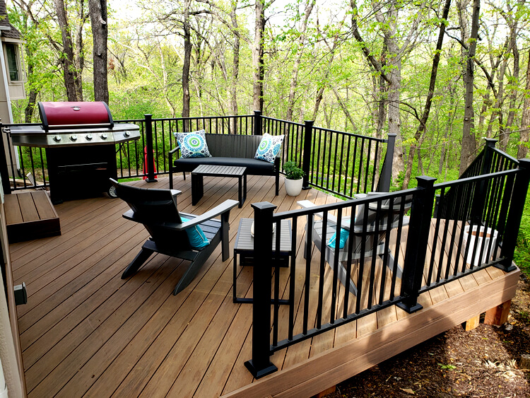 Custom deck with outdoor kitchen and railing
