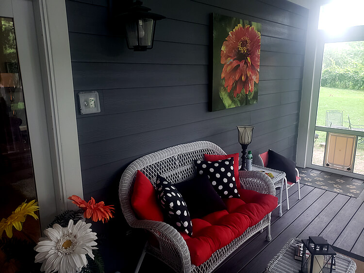 Cozy couch on screened porch
