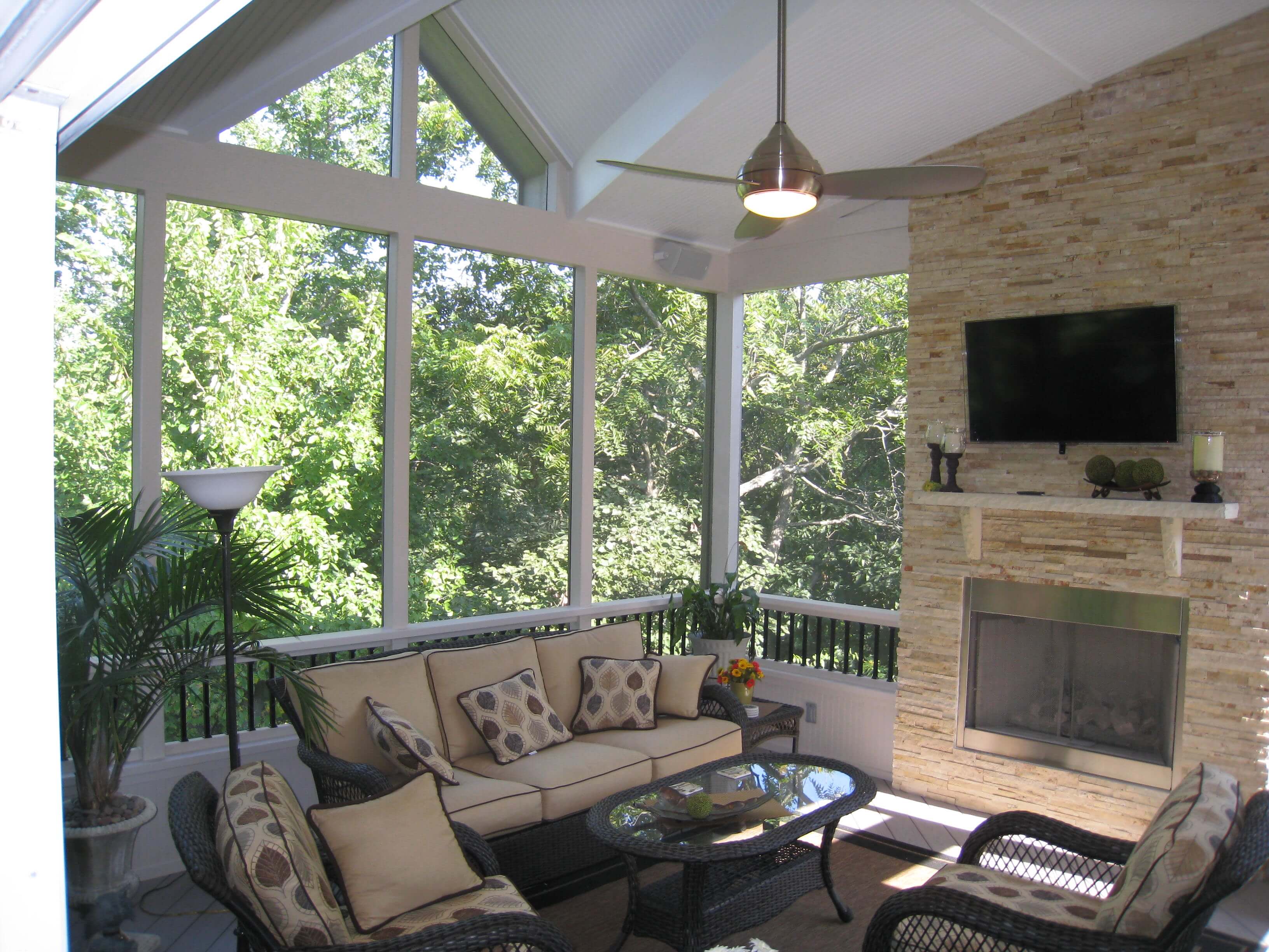 Outdoor fireplace in screened in porch 