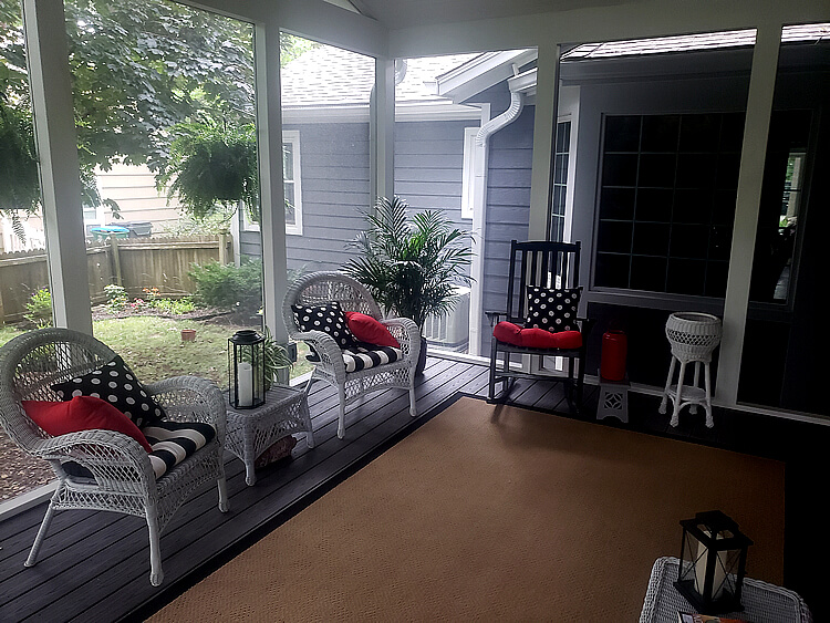 screened porch with chairs