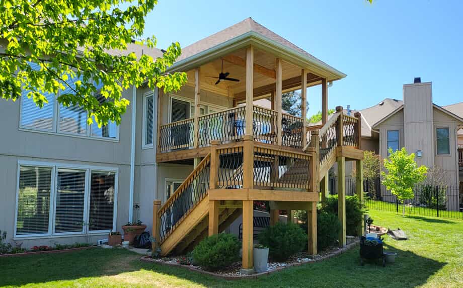 Covered deck with belly baluster infill railings