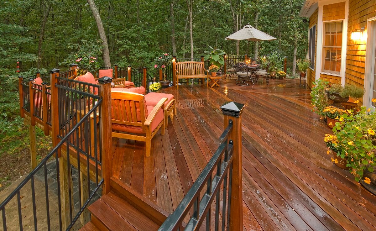 Ipe deck at night with outdoor lighting and furniture 