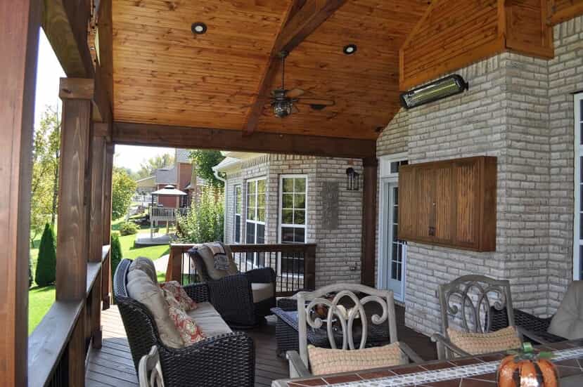 covered porch with wood and rock details