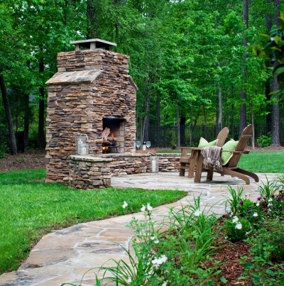 patio with rock fireplace