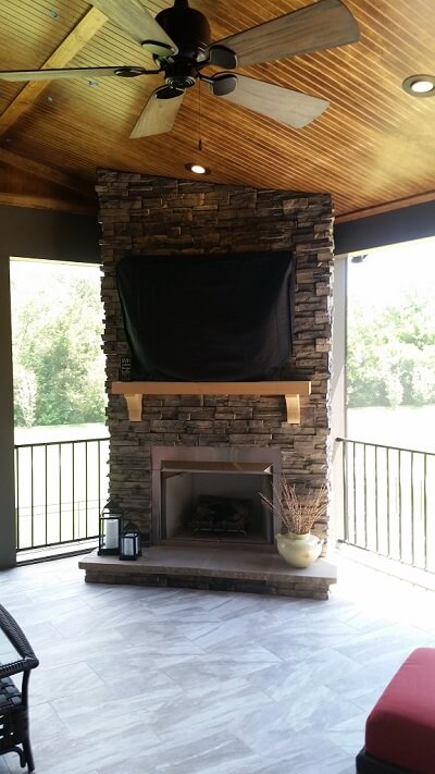 Custom second story porch with fireplace