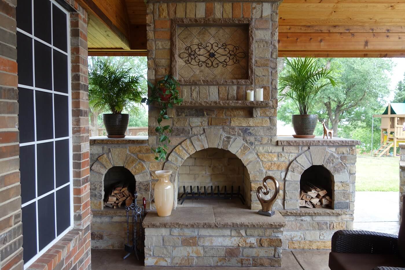 Outdoor fireplace in covered patio 