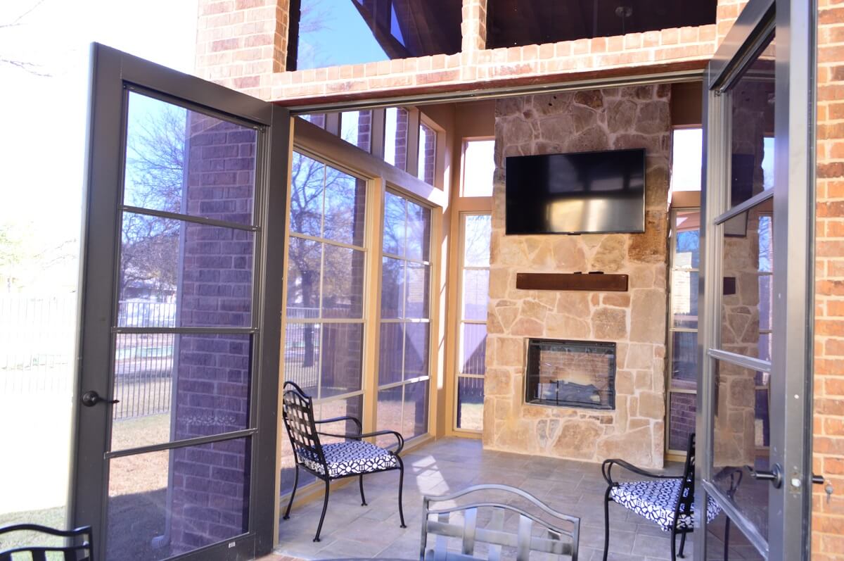 screened porch with fireplace