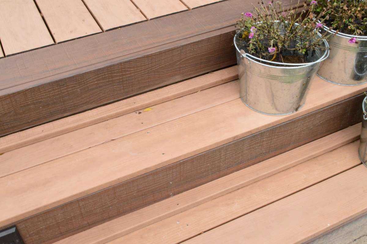 wood deck with plants on bucket