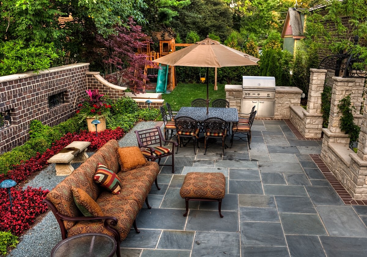 patio with chairs and table and plants