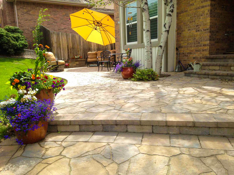 Stone patio with second level deck