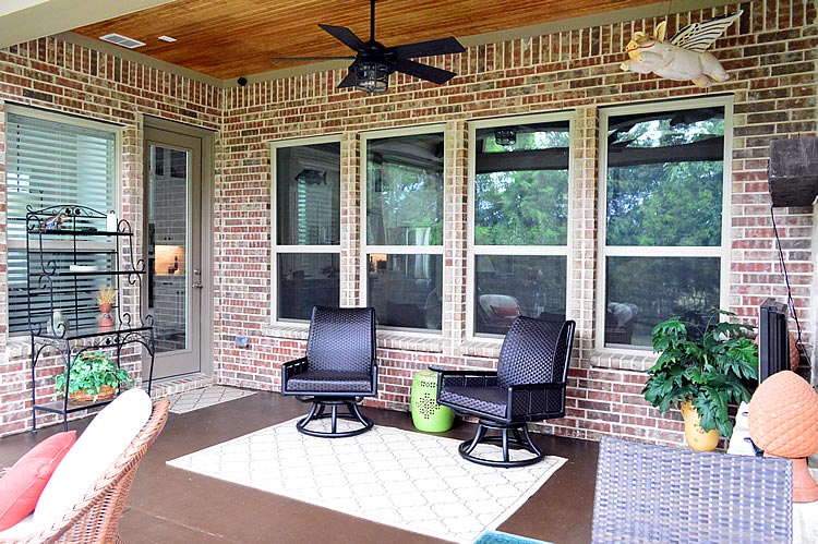 Covered screen patio with furniture