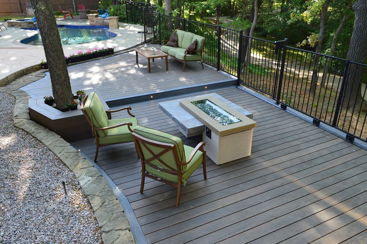 Custom poolside deck with fire pit area