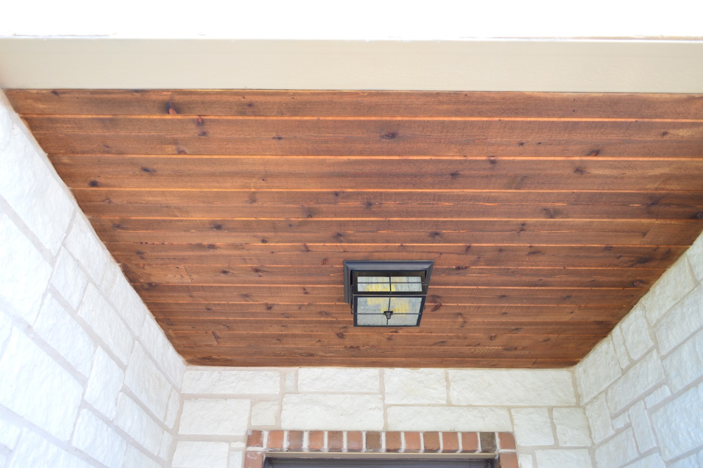 tongue and groove cedar ceiling accented for texture and detail with Walnut Stain