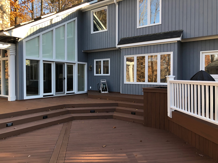 Greensboro deck with stairs leading to home.