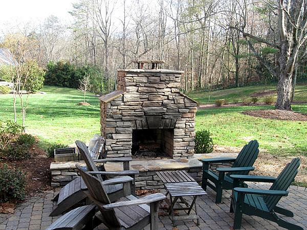 Stacked stone outdoor fireplace