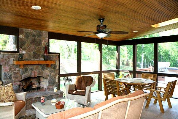 Sunroom with outdoor fireplace