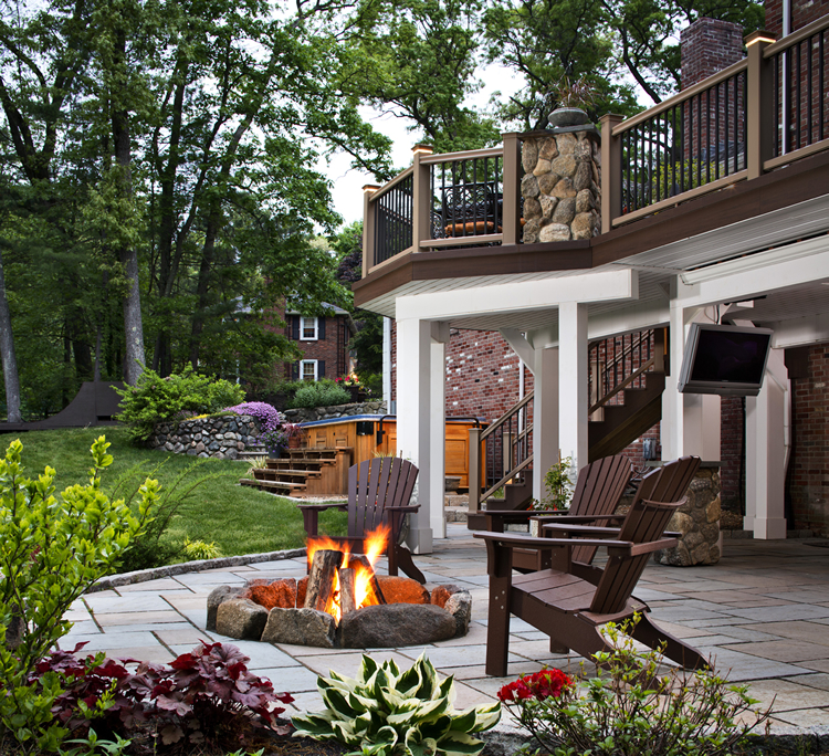 Deck and firepit in backyard.