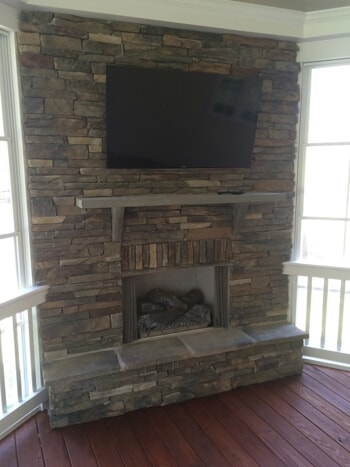 stacked stone porch fireplace 