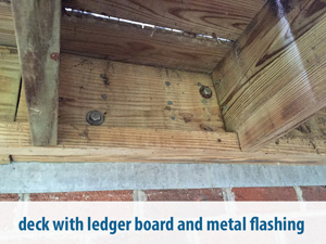 deck with ledger board and metal flashing 