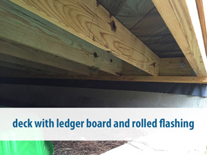 deck with ledger board and rolled flashing