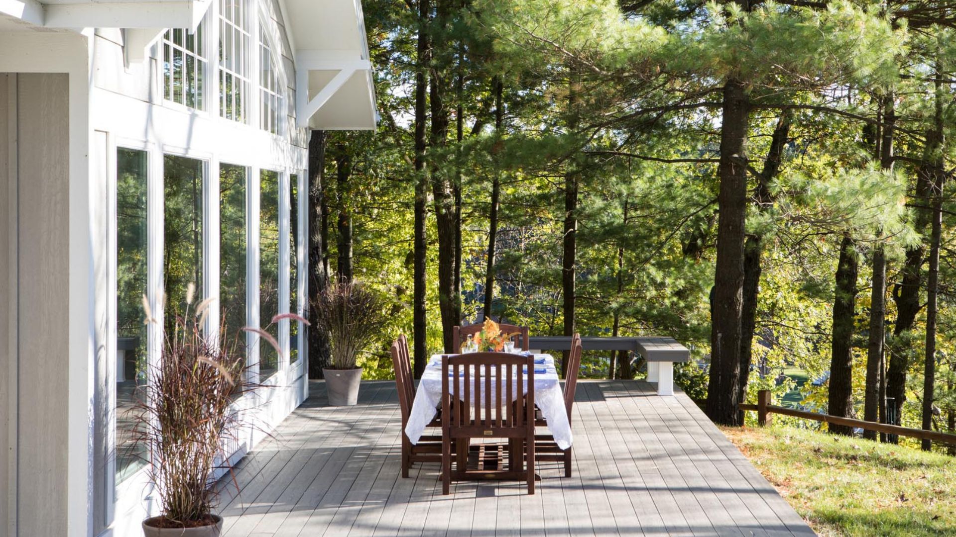 A table and chairs on a deck
AI-generated content may be incorrect.