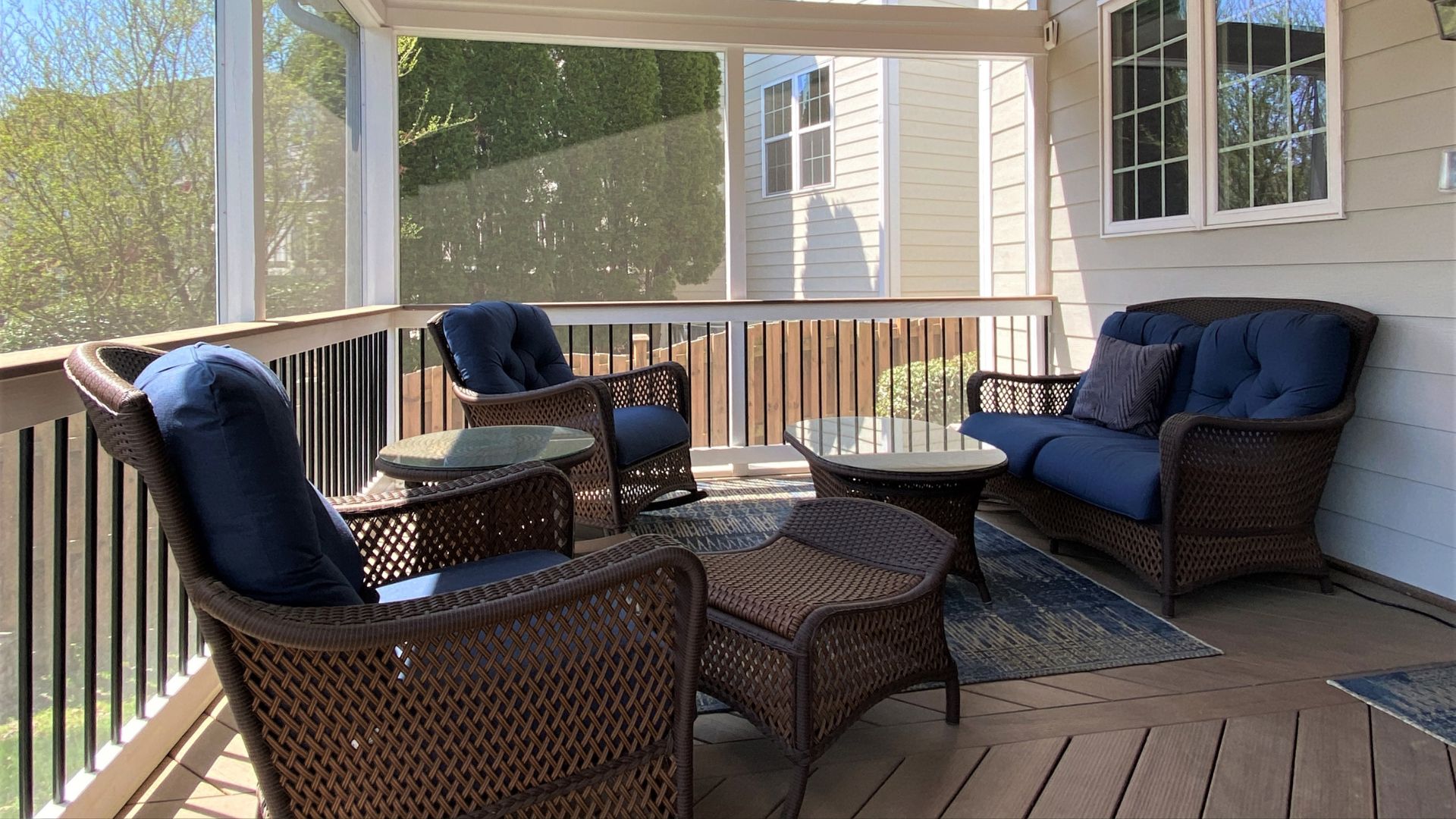 screened in porch with patio furniture