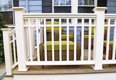Outdoor porch with railing.