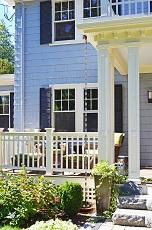 Front porch with white railing.