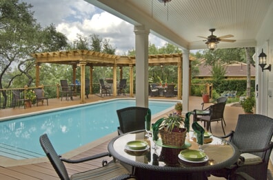 poolside deck with pergola and roof covers