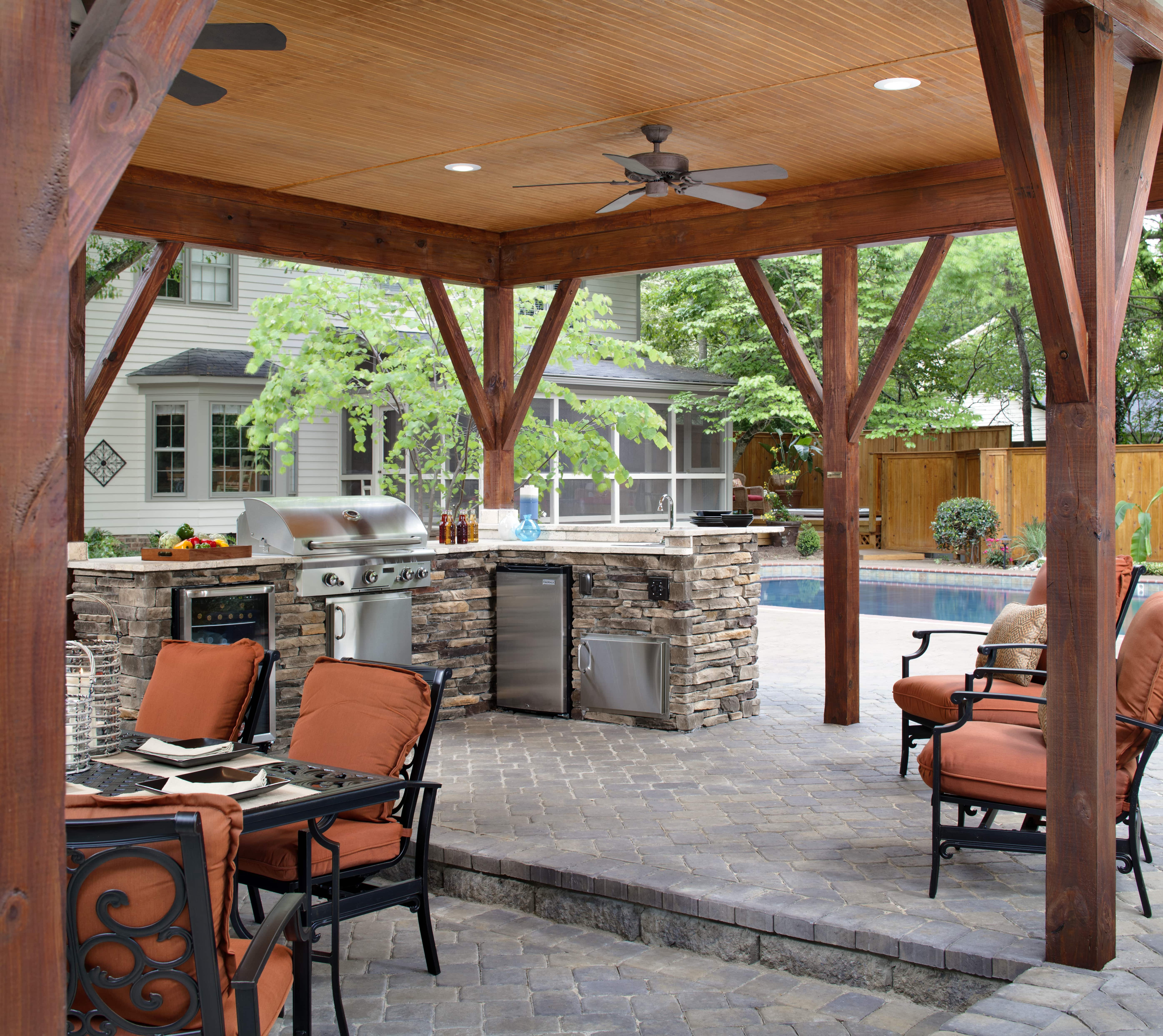 Outdoor living space with outdoor kitchen feature