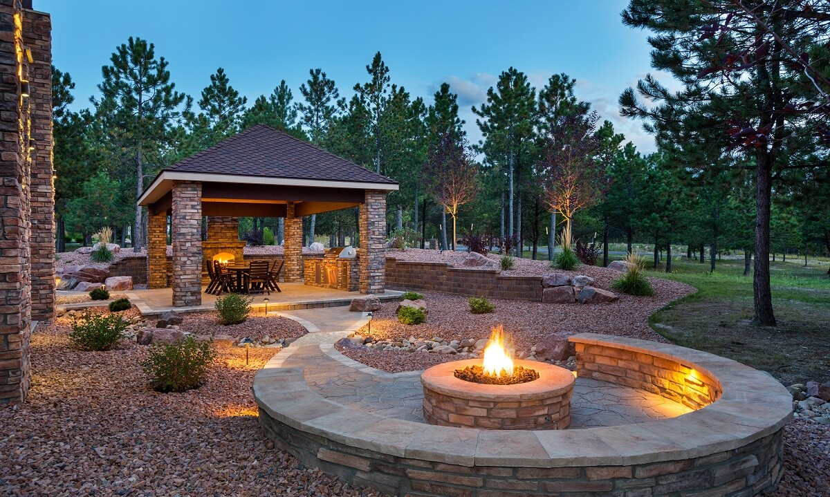 Shaded outdoor shaded seating area with two fire features