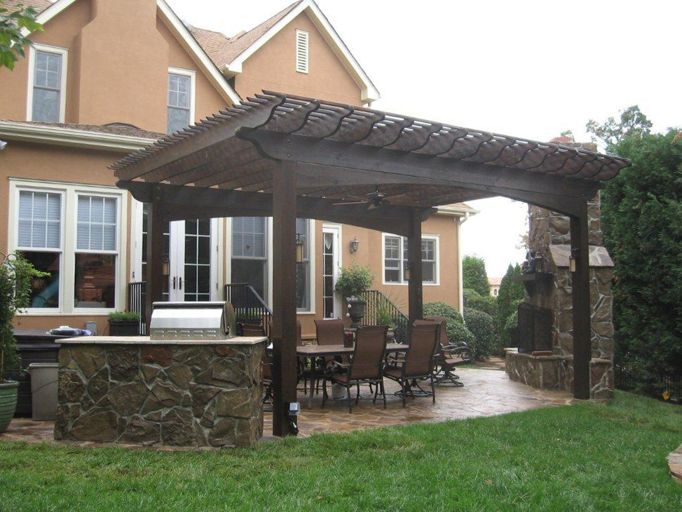Large wooden pergola with outdoor kitchen
