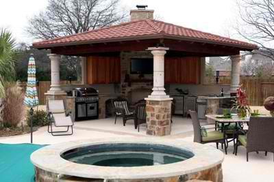 Outdoor pergola with seating area and water feature