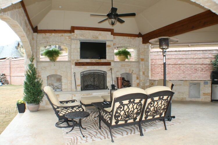 covered patio with outdoor fireplace
