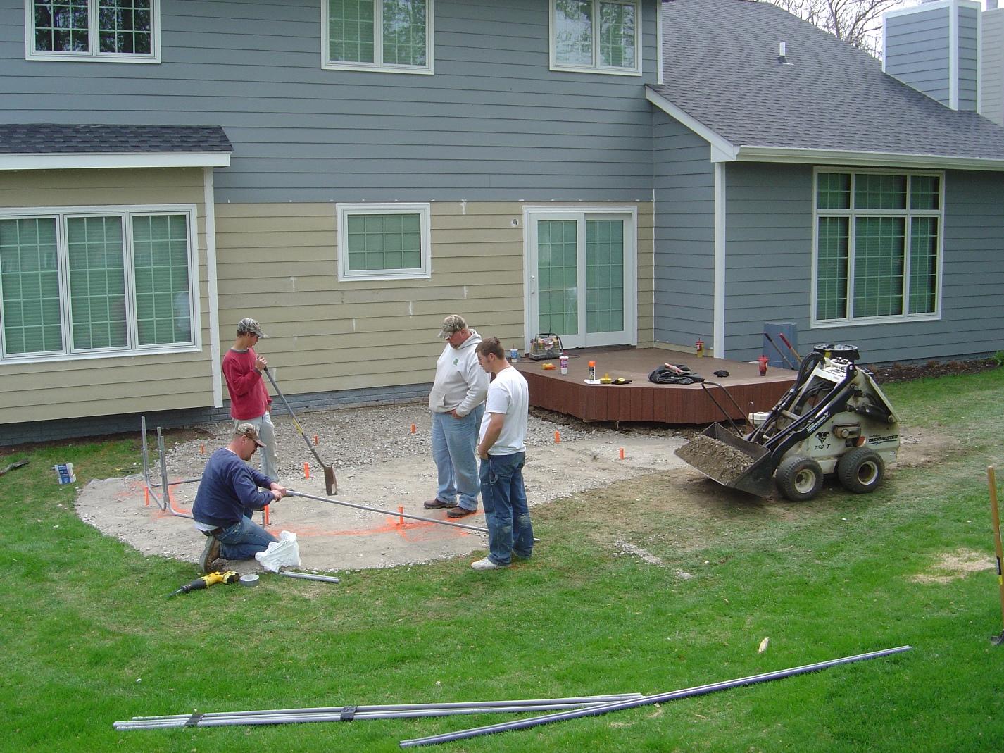 Archadeck employees working on a patio project