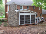 eze breeze porch with stone fireplace