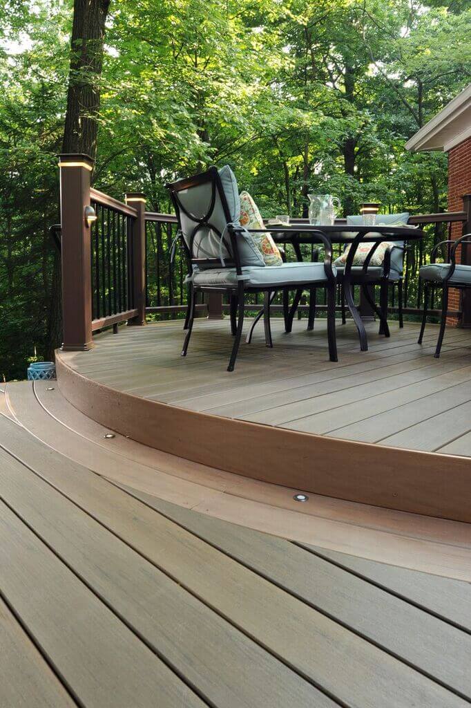 wood deck with railings and chairs