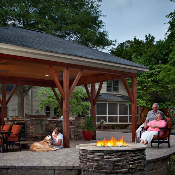 Family enjoying their patio with a fire pit