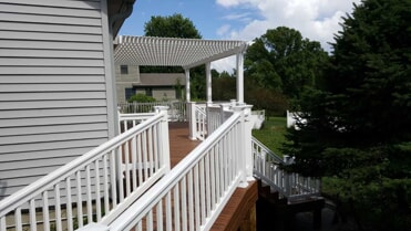 deck with railing and stairs
