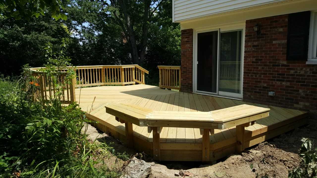 low to grade wooden deck with custom bench seating
