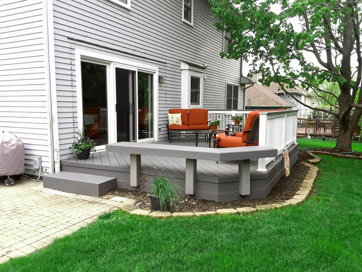 Low maintenance deck with floating bench
