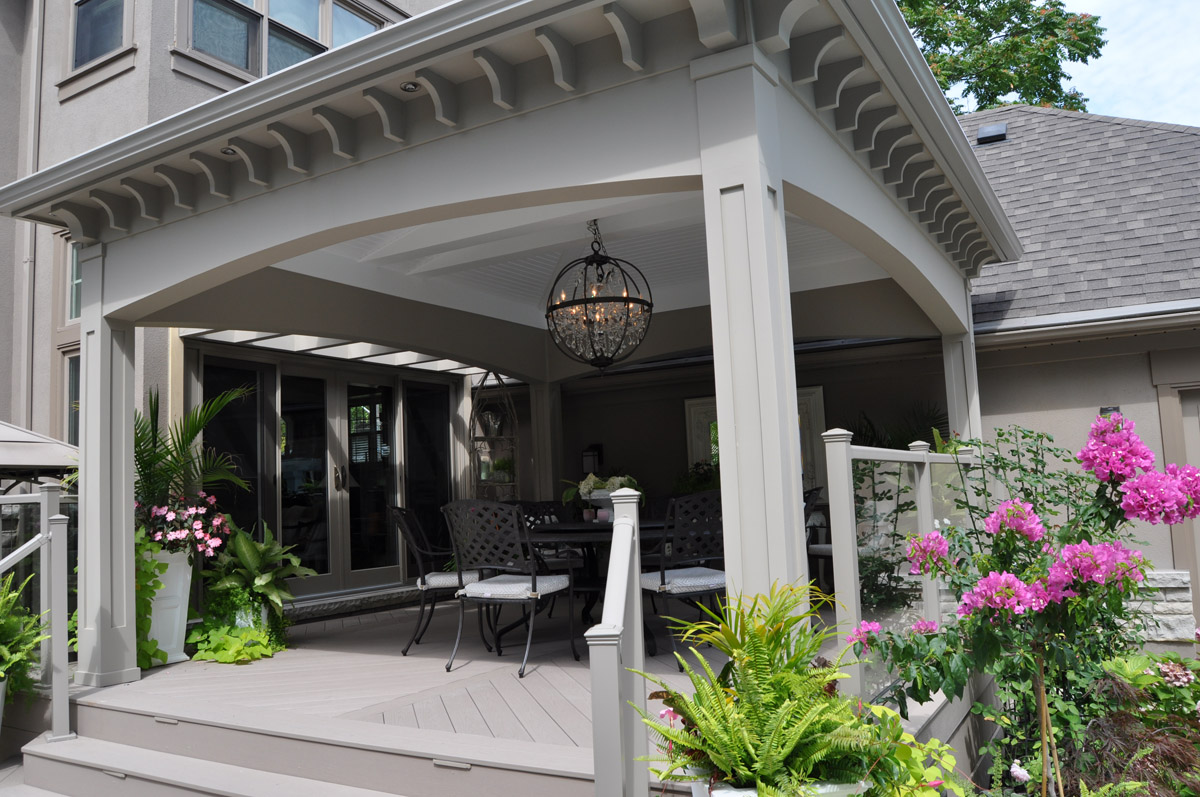 Open air composite deck with porch roof.