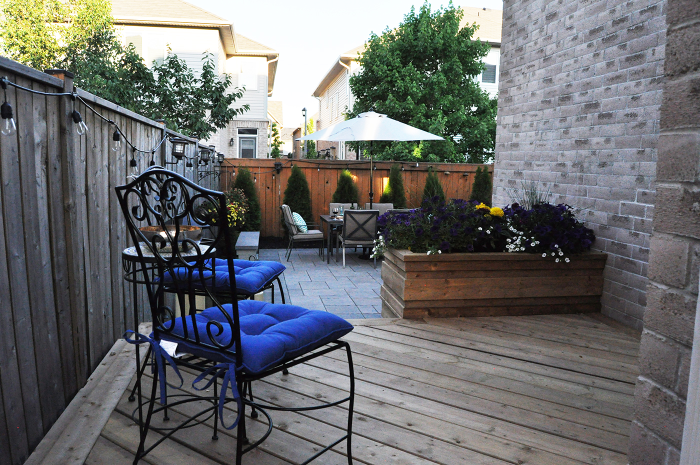 Wood deck and Unilock paver patio.