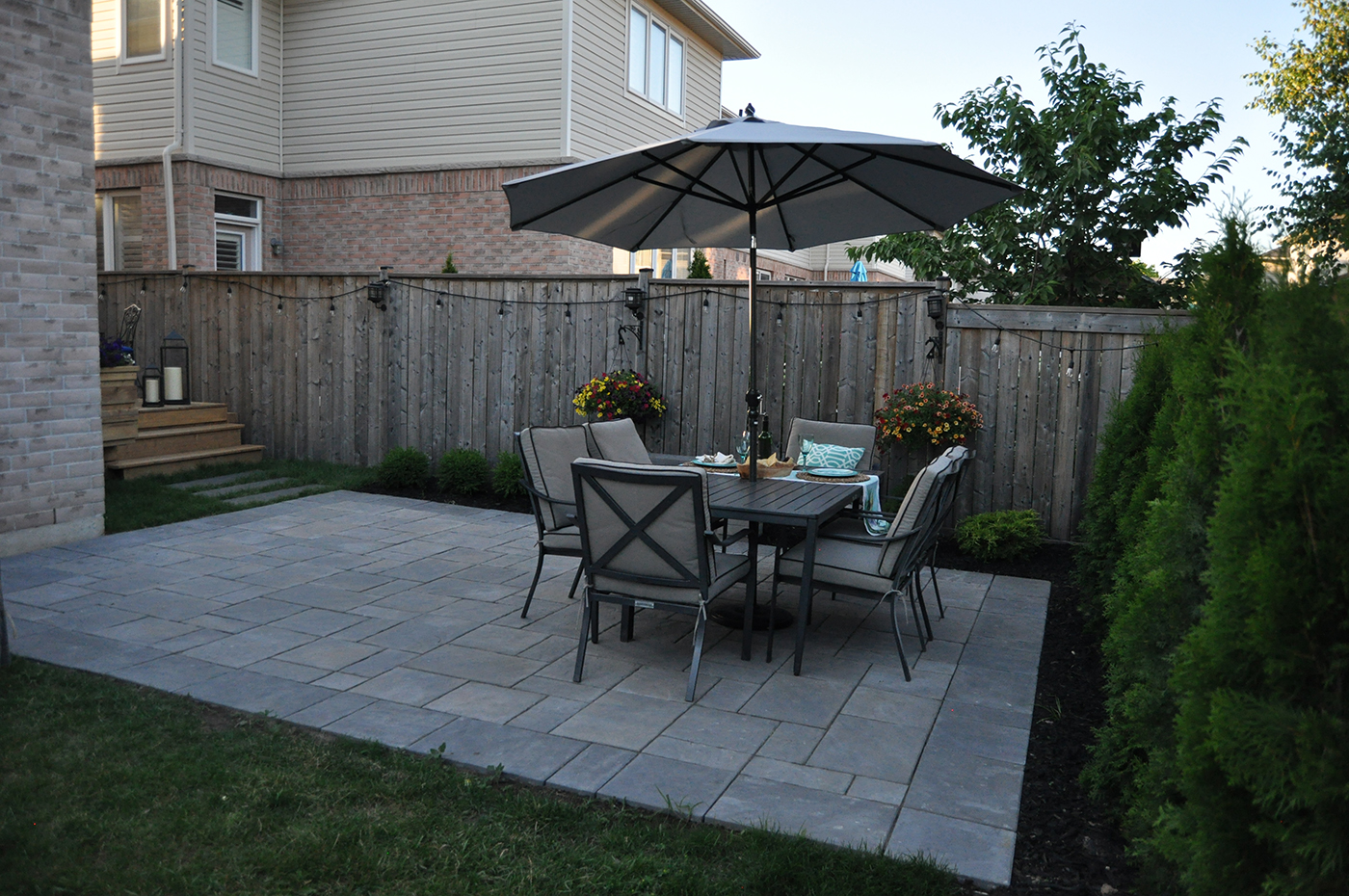 Unilock patio with table and chairs.