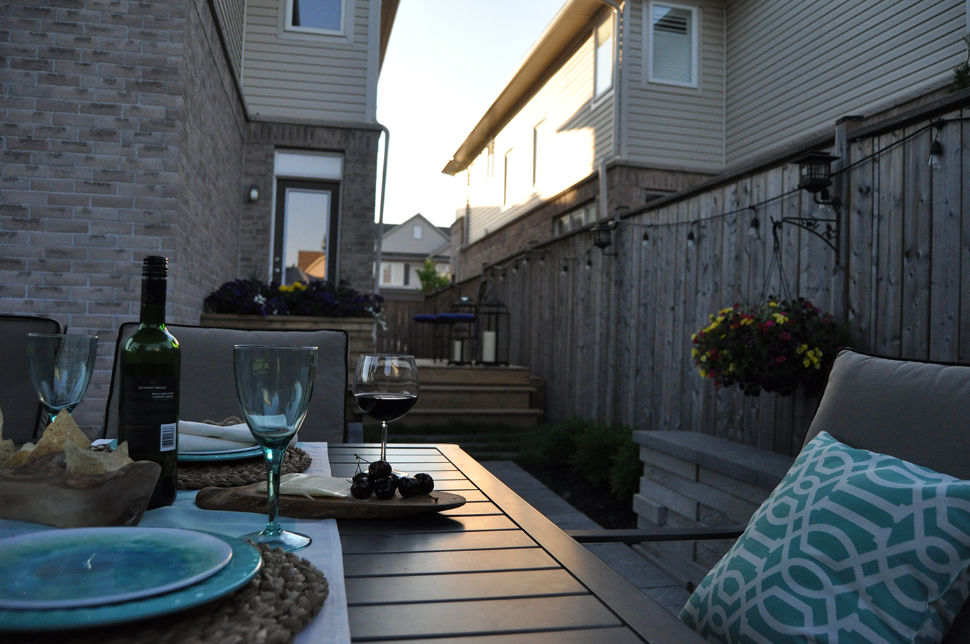 Outdoor table set for dinner. 